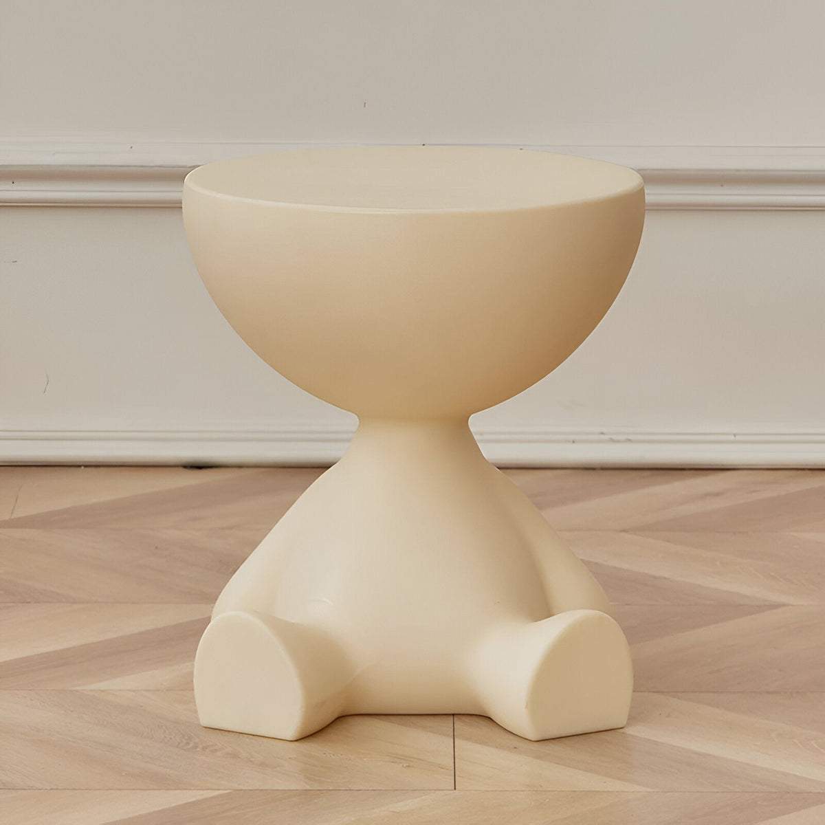 Round coffee table in creamy white with sculptural pedestal base and smooth top on Tampa Home & Garden Store