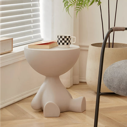 Round white Moktan Sabai coffee table with sculptural pedestal base; mug and book on top on Tampa Home & Garden Store