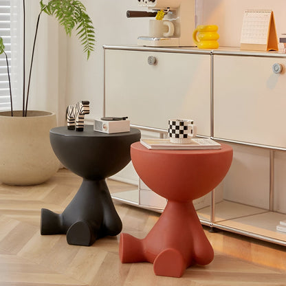 Round coffee tables by Moktan Sabai in black and terracotta with zebra figurine on Tampa Home & Garden Store