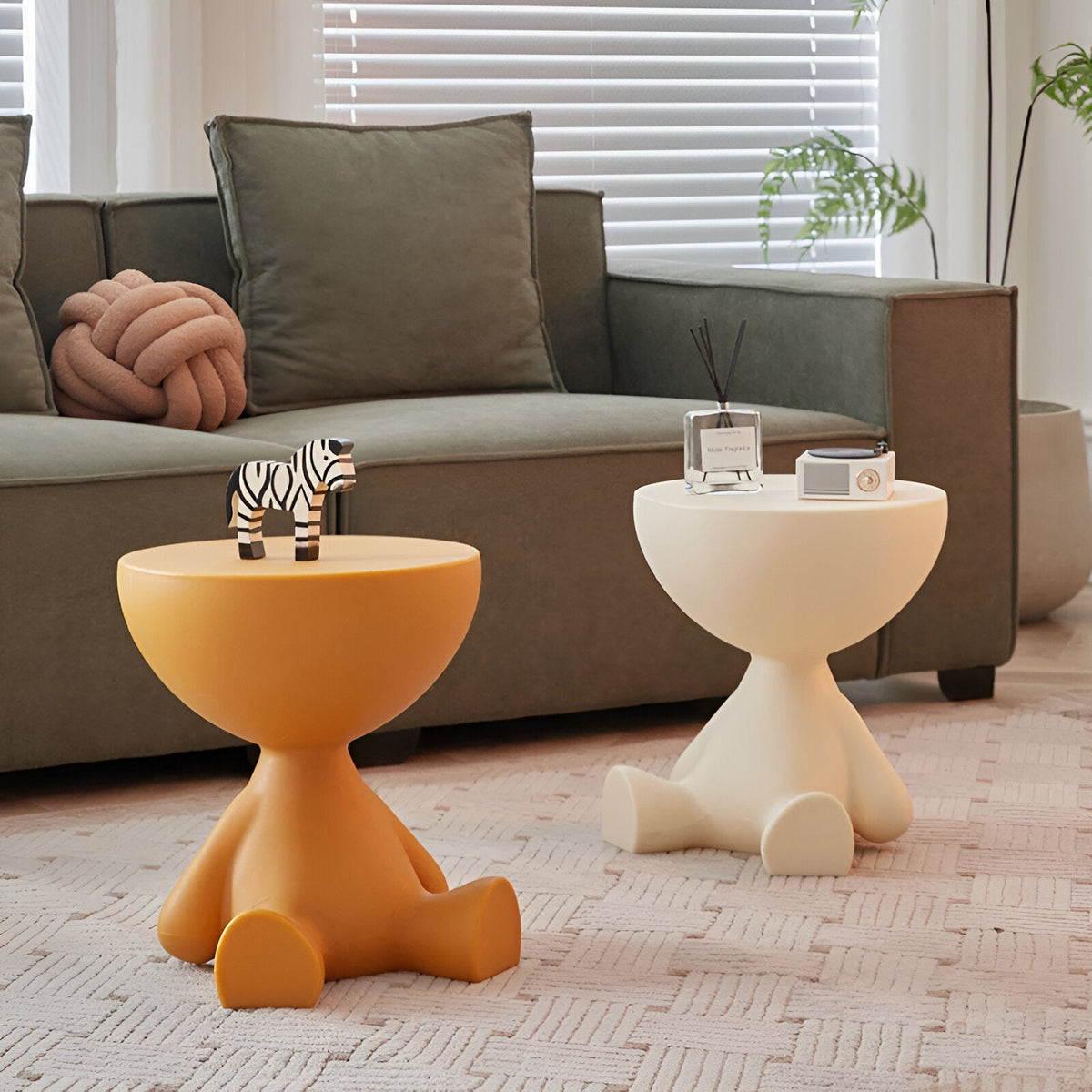 Round Coffee Tables by Moktan Sabai, two orange and white pedestal end tables beside a gray sofa on Tampa Home & Garden Store