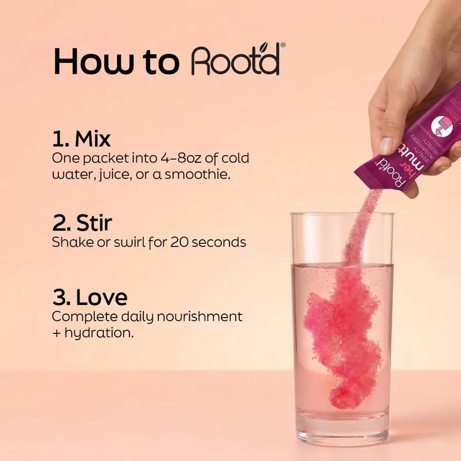 Advanced Daily Nutrition for Her multivitamin pink powder poured into glass of water Root'd on Tampa Home & Garden Store