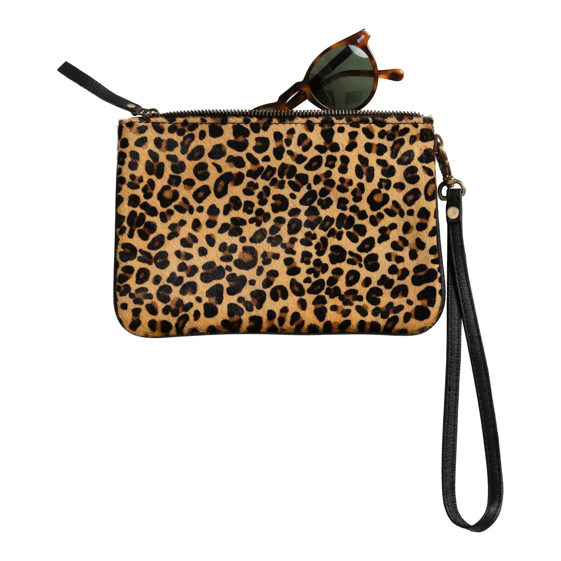 Huntley Equestrian leopard print hair-on-hide wristlet clutch with black strap and sunglasses on Tampa Home & Garden Store