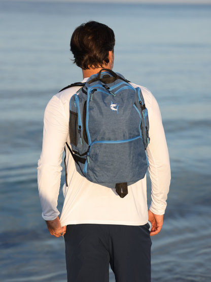 Day Trip Backpack Blue fabric with zip pockets, White Water Life brand, viewed from back on Tampa Home & Garden Store
