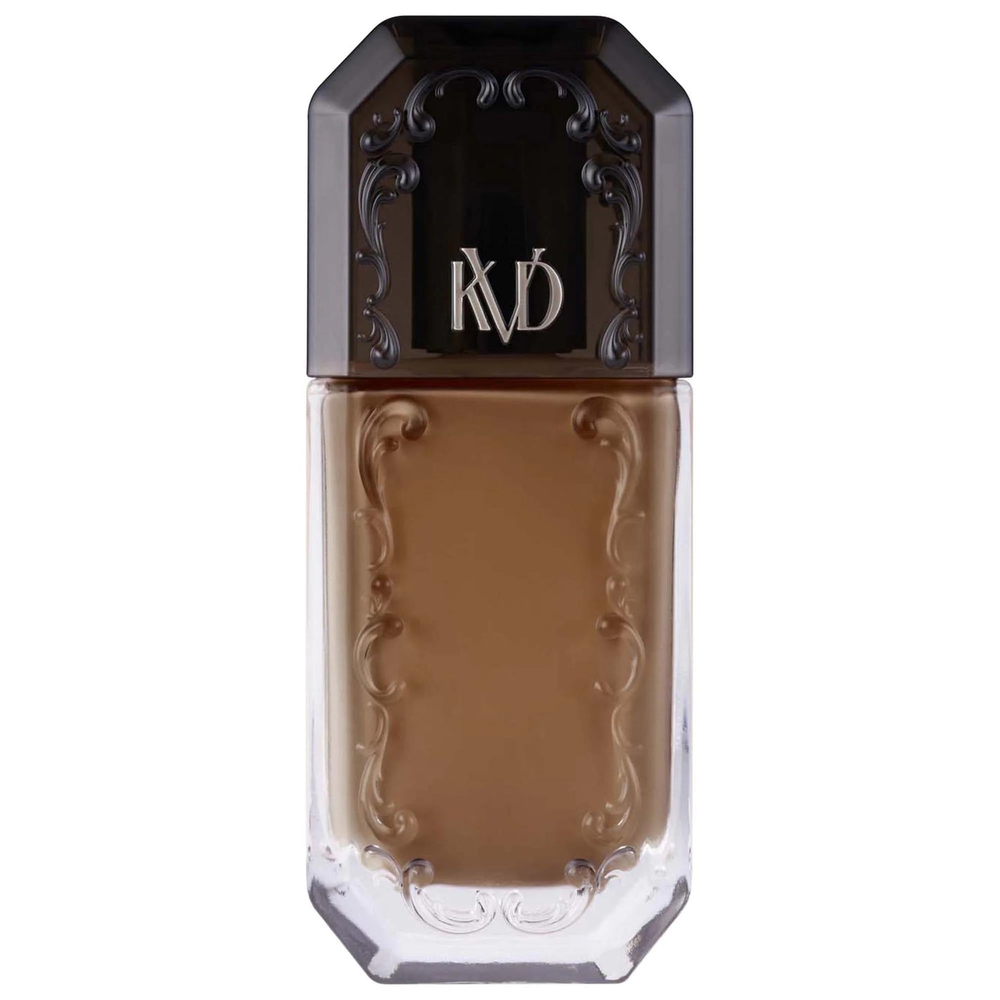 Foundation bottle with ornate black cap marked KD, warm caramel liquid in glass bottle on Tampa Home & Garden Store