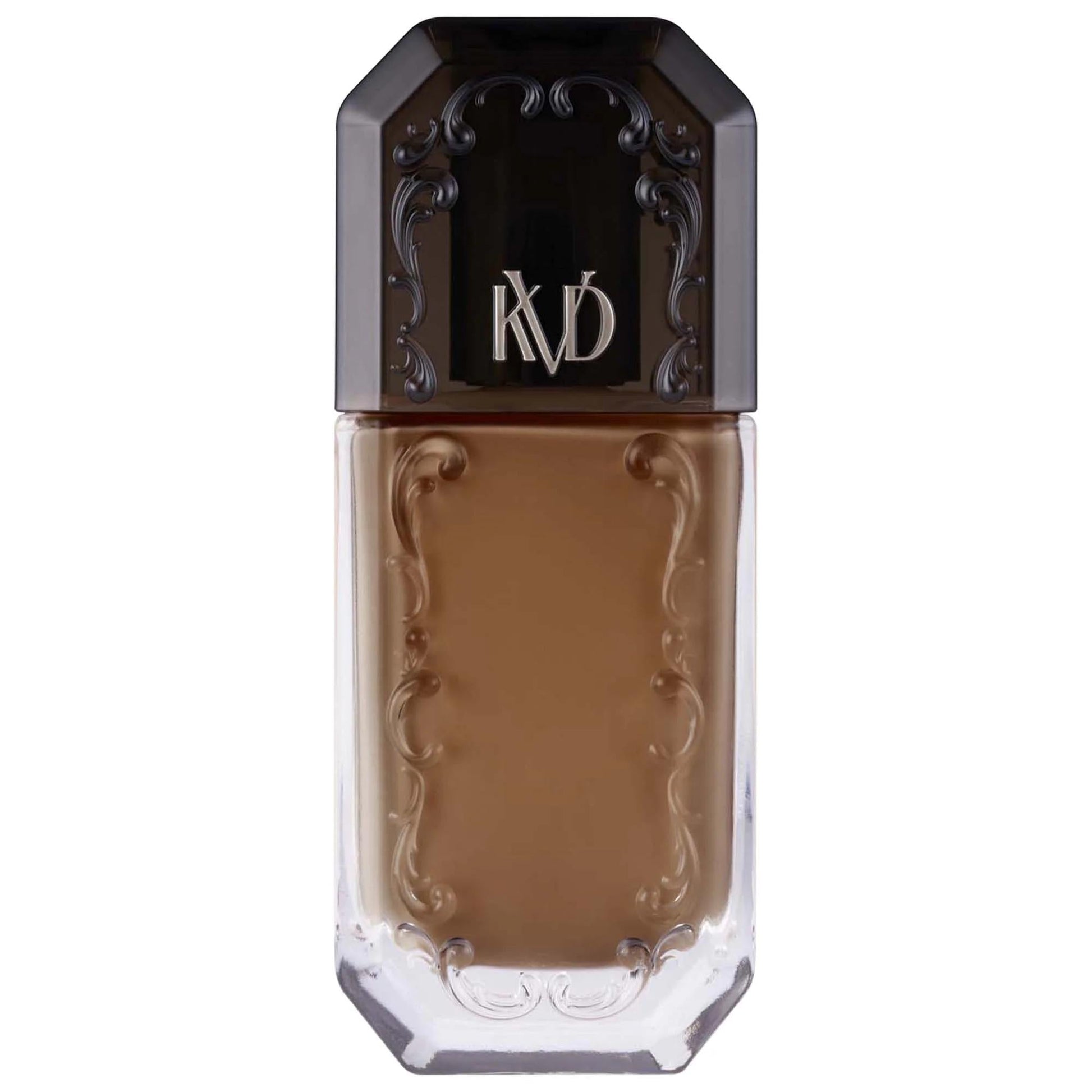 Foundation bottle with ornate black cap marked KD, warm caramel liquid in glass bottle on Tampa Home & Garden Store