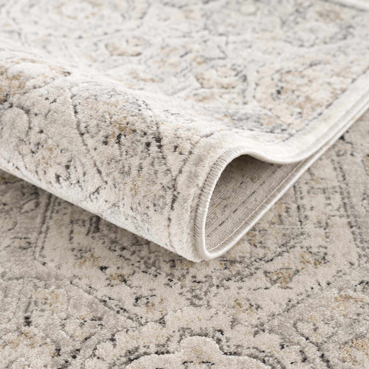 Parkerfield Area Rug in soft beige-gray with a subtle distressed pattern on Tampa Home & Garden Store