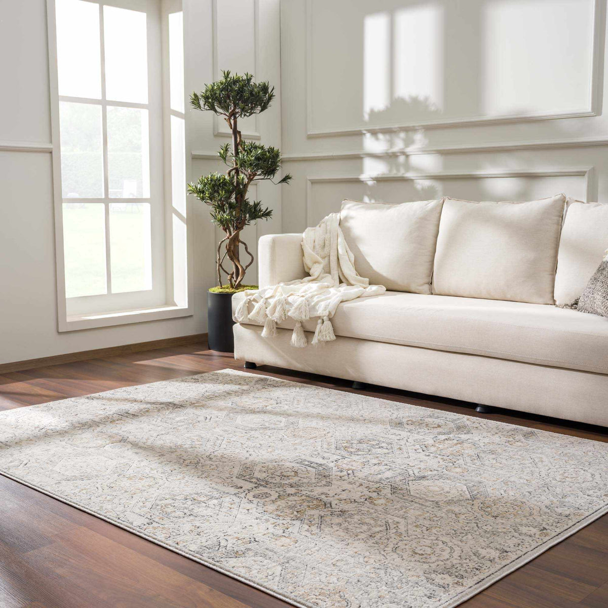 Parkerfield Area Rug by Boutique Rugs, beige neutral with subtle vintage motif in living room on Tampa Home & Garden Store