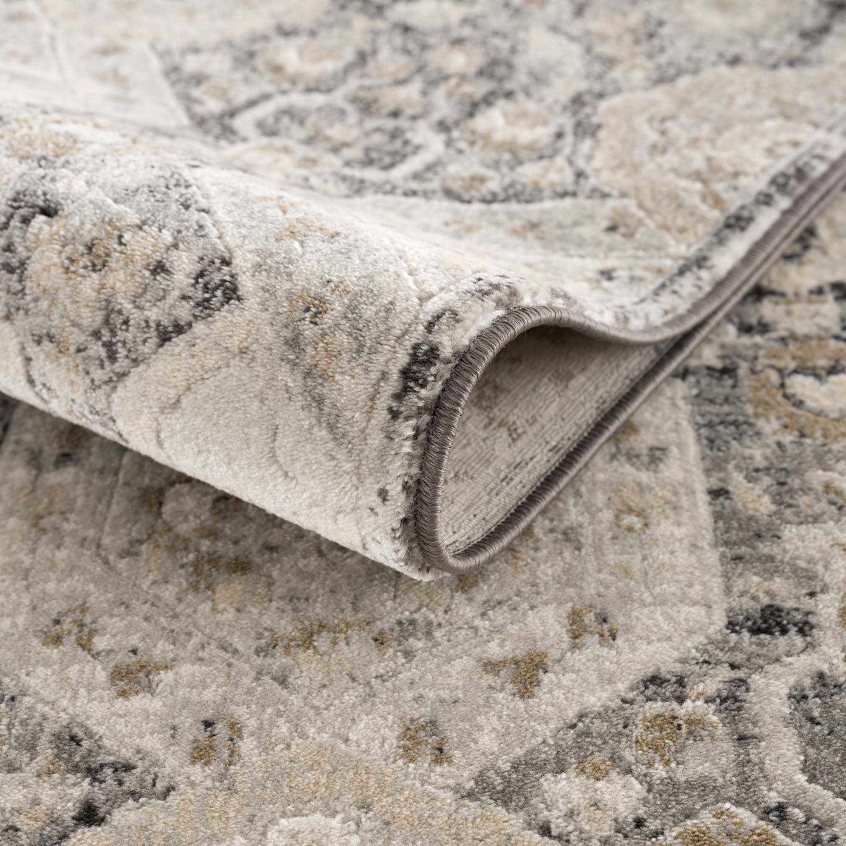Minoa Area Rug by Boutique Rugs in beige-gray with a subtle distressed pattern, soft pile on Tampa Home & Garden Store