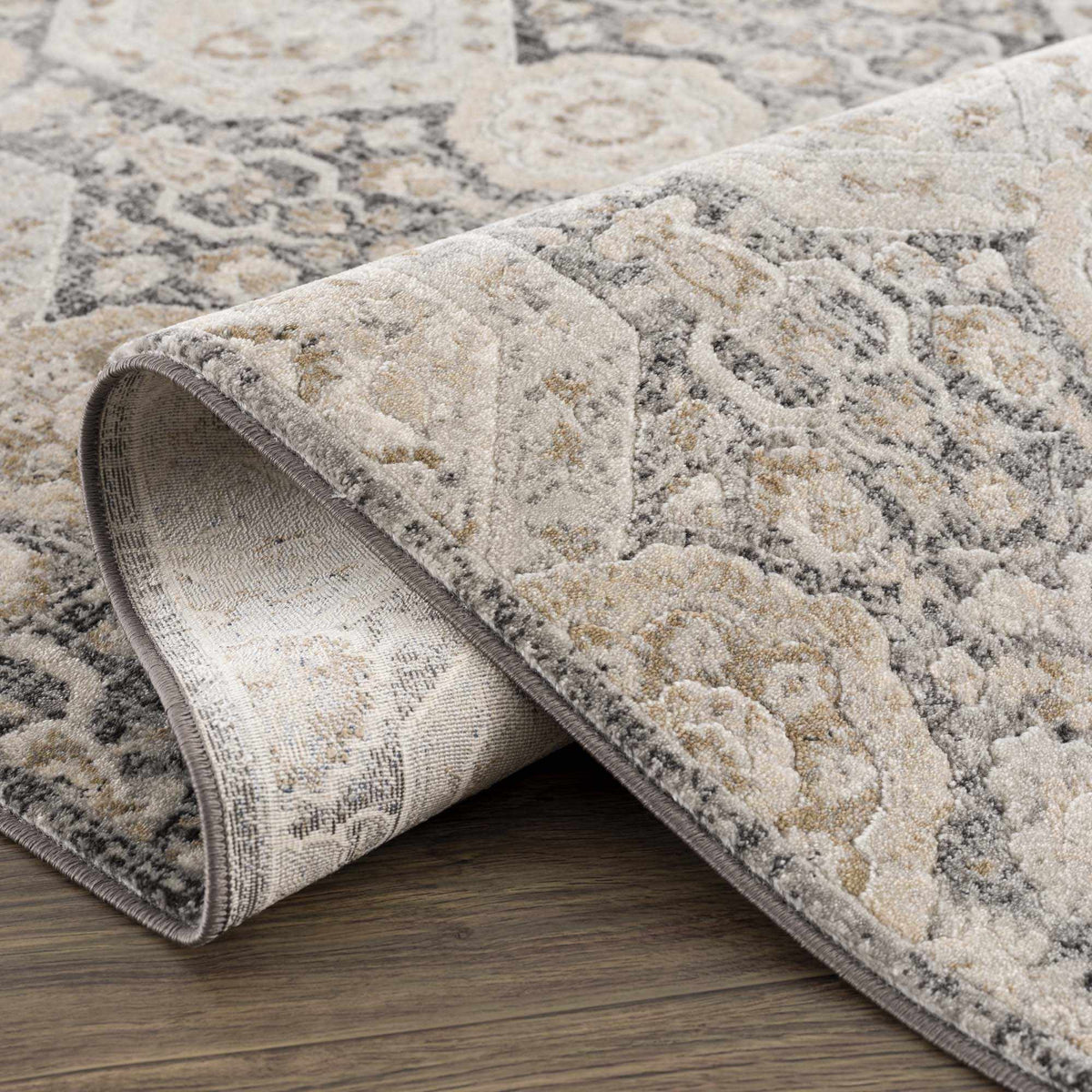 Minoa Area Rug by Boutique Rugs in soft gray and beige with a distressed pattern on plush pile on Tampa Home & Garden Store
