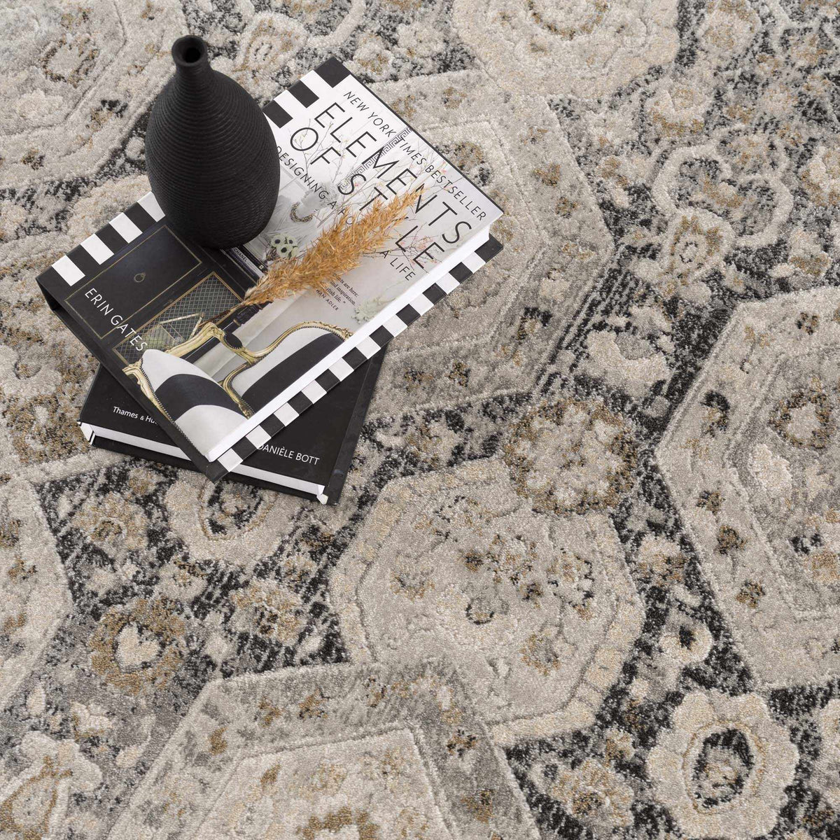 Minoa area rug by Boutique Rugs in neutral beige-gray with abstract pattern and decor items on Tampa Home & Garden Store