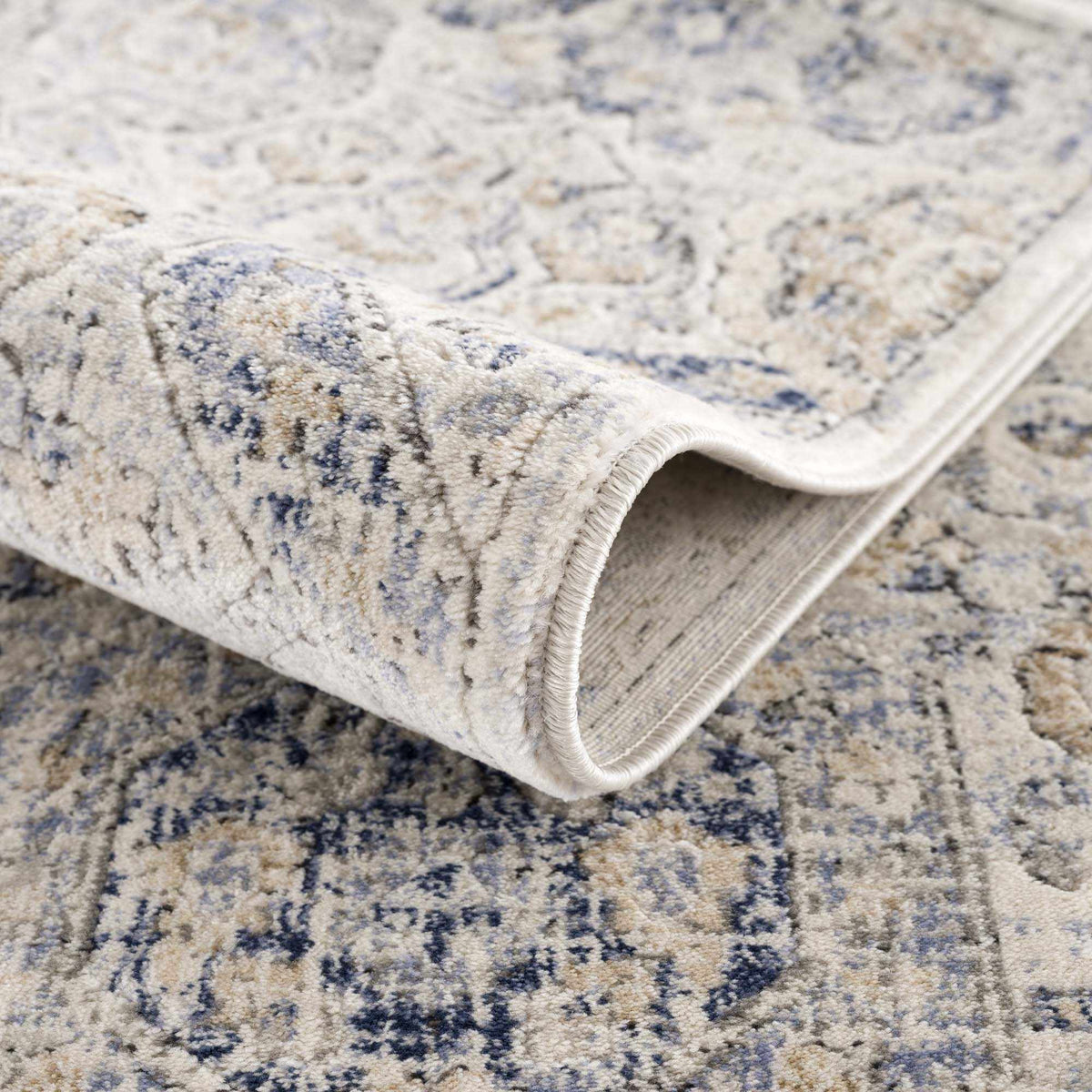 Parkerfield Cream & Blue Area Rug by Boutique Rugs, cream blue distressed pattern, rolled edges on Tampa Home & Garden Store