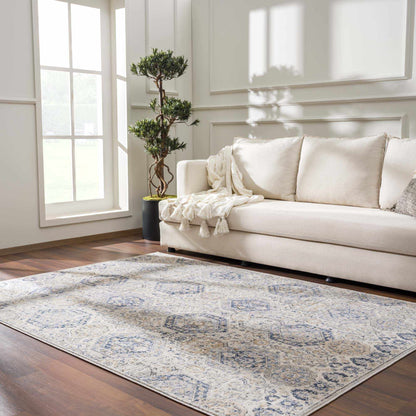 Parkerfield Cream & Blue Area Rug with cream base and blue pattern in a bright living room on Tampa Home & Garden Store