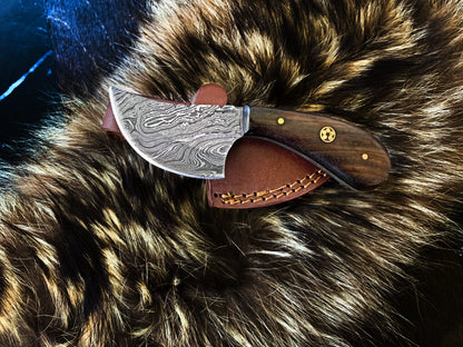 TD-090 Titan Intl. K damascus blade knife with wood handle and leather sheath on fur background on Tampa Home & Garden Store