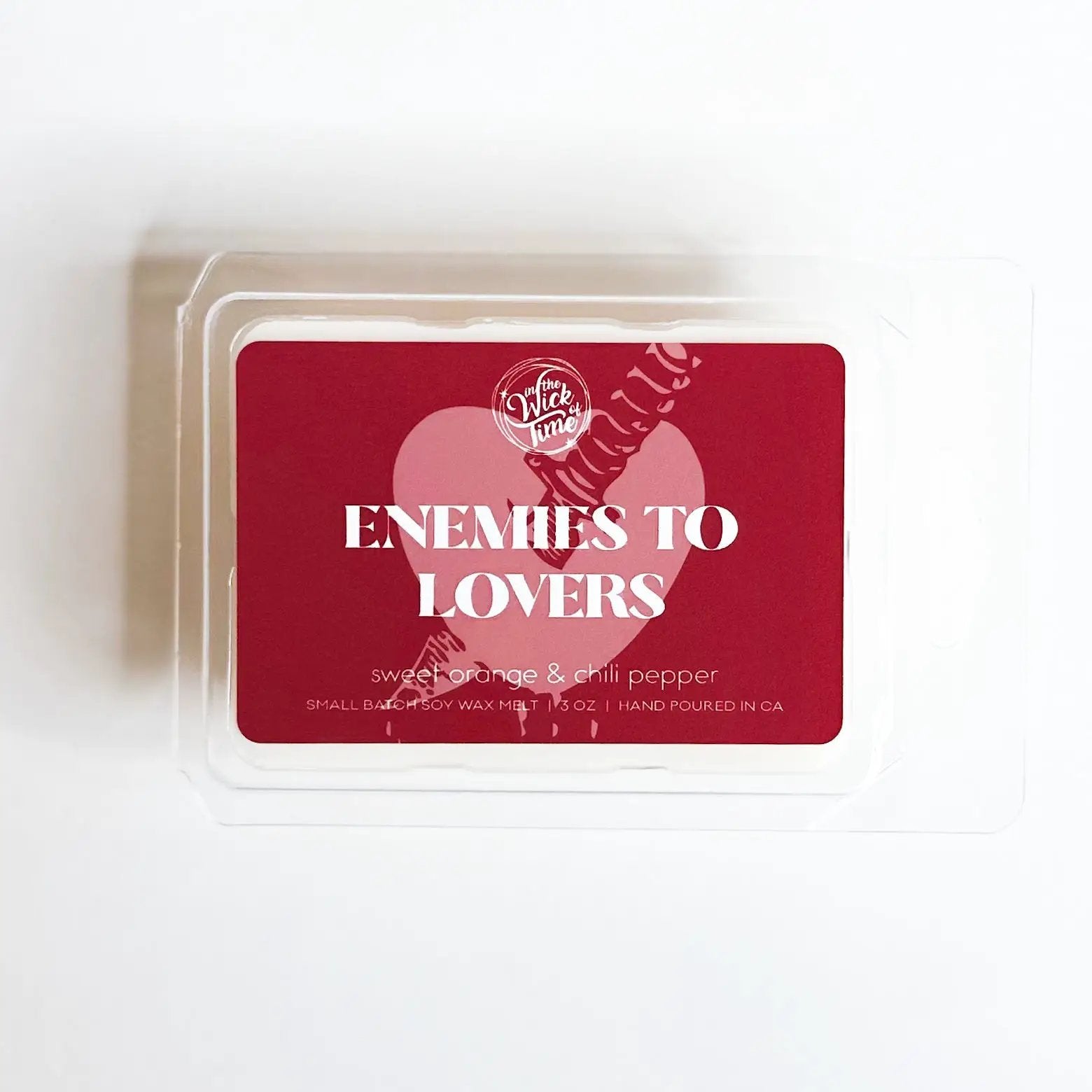 Enemies to Lovers Wax Melt by In the Wick of Time, red label with heart motif and orange jasmine chili scent on Tampa Home & Garden Store