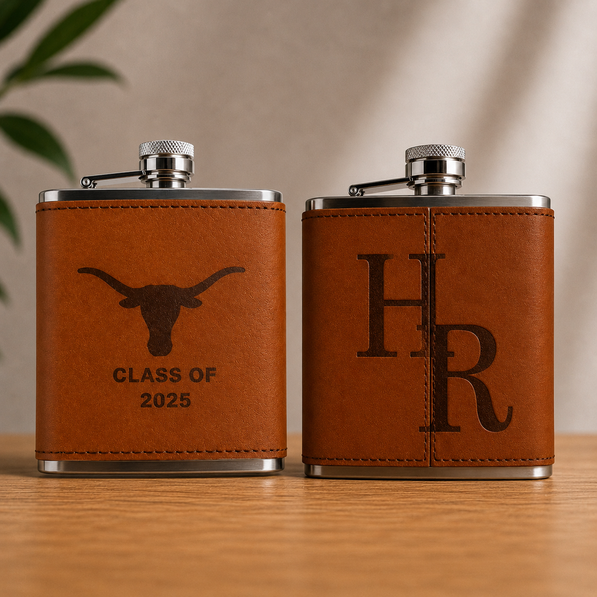 Two Texas Longhorns leather flasks by Ryan's Woodworking, brown leather wraps with metal caps on Tampa Home & Garden Store