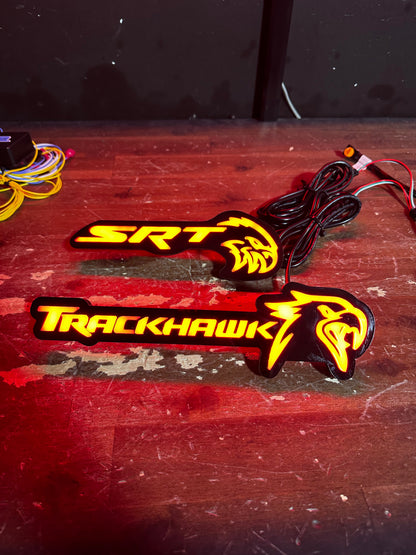 Jeep Trackhawk RGBW Flow Series LED grill emblem illuminated in red with hawk logo on Tampa Home & Garden Store