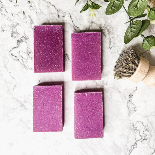 Patchouli and Raspberry Soap Bar with Sea Salt, four purple rectangular bars on marble background on Tampa Home & Garden Store