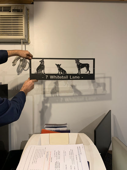 Custom metal pet sign with 3 black dog silhouettes and address 7 Whitetail Lane on Tampa Home & Garden Store