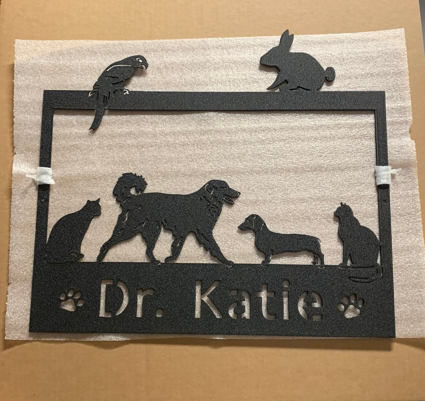 Black metal pet sign with dog, cat, bird and rabbit on address frame by Rustica Ornamentals on Tampa Home & Garden Store
