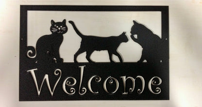 Custom metal pet sign with three silhouettes and a white Welcome script on black frame on Tampa Home & Garden Store