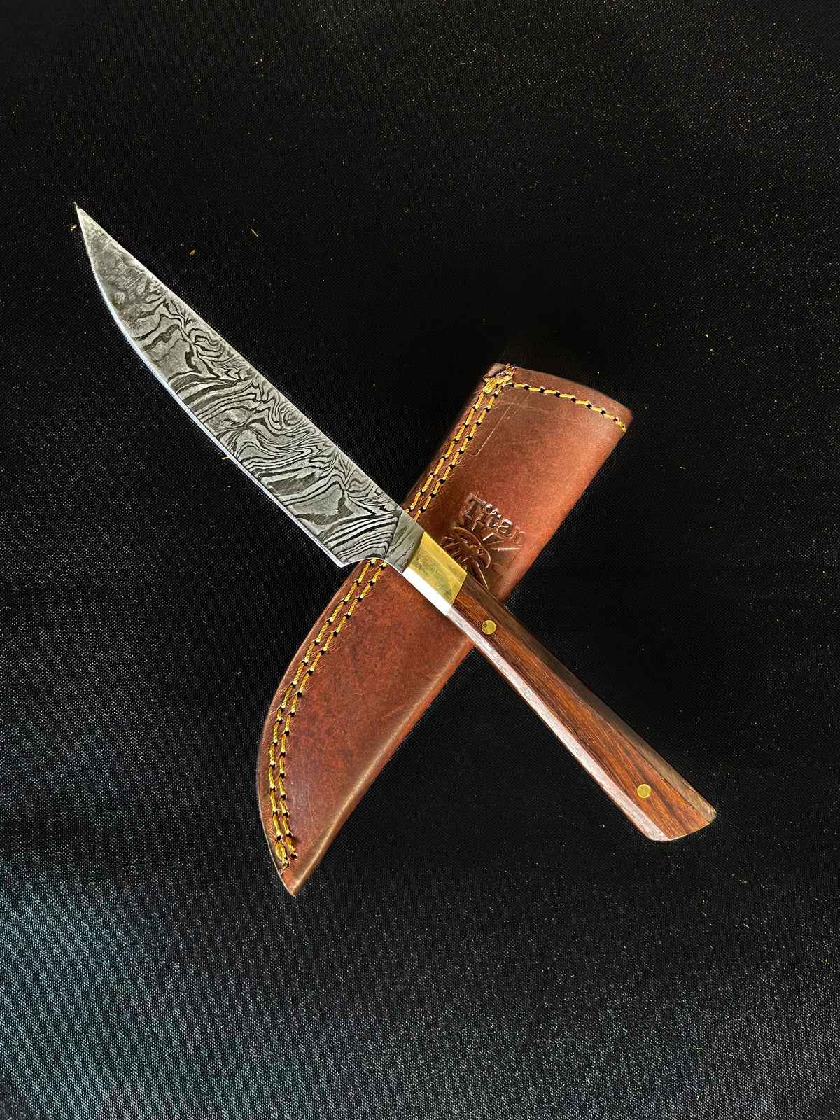 Damascus steel steak knife with patterned blade and brass bolster leather sheath on Tampa Home & Garden Store