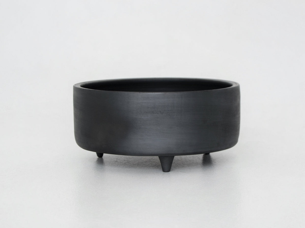 Tall serving bowl with lid Guculia Shadow in matte black ceramic on three feet on Tampa Home & Garden Store