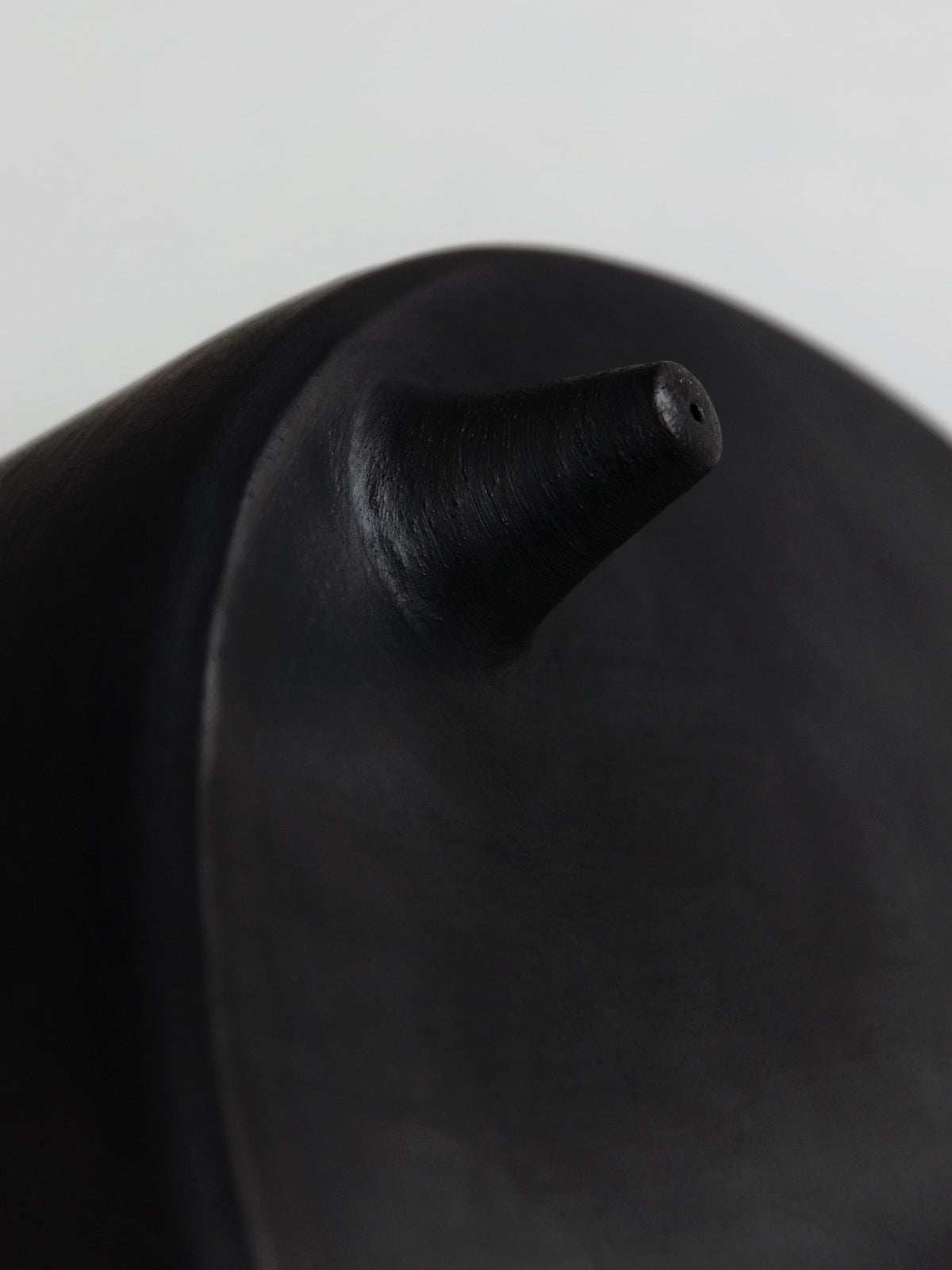 Tall serving bowl with lid in black matte finish, close-up of its curved spout on Tampa Home & Garden Store