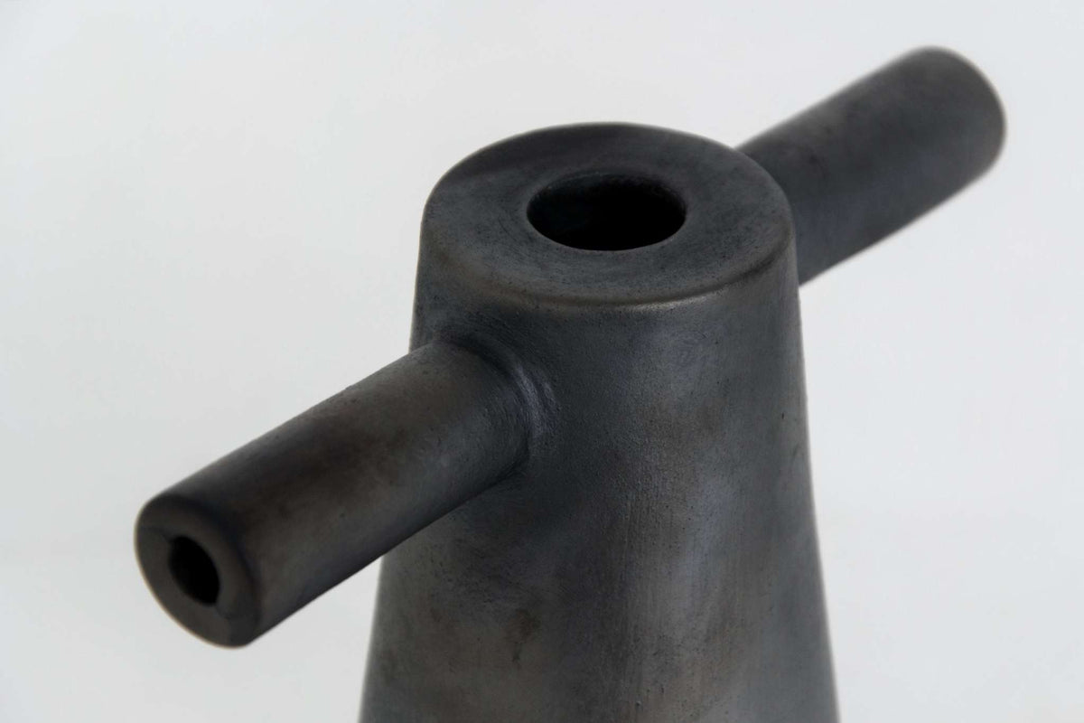 Black stoneware Motanka tall candle holder with a horizontal tubular arm and hollow top on Tampa Home & Garden Store