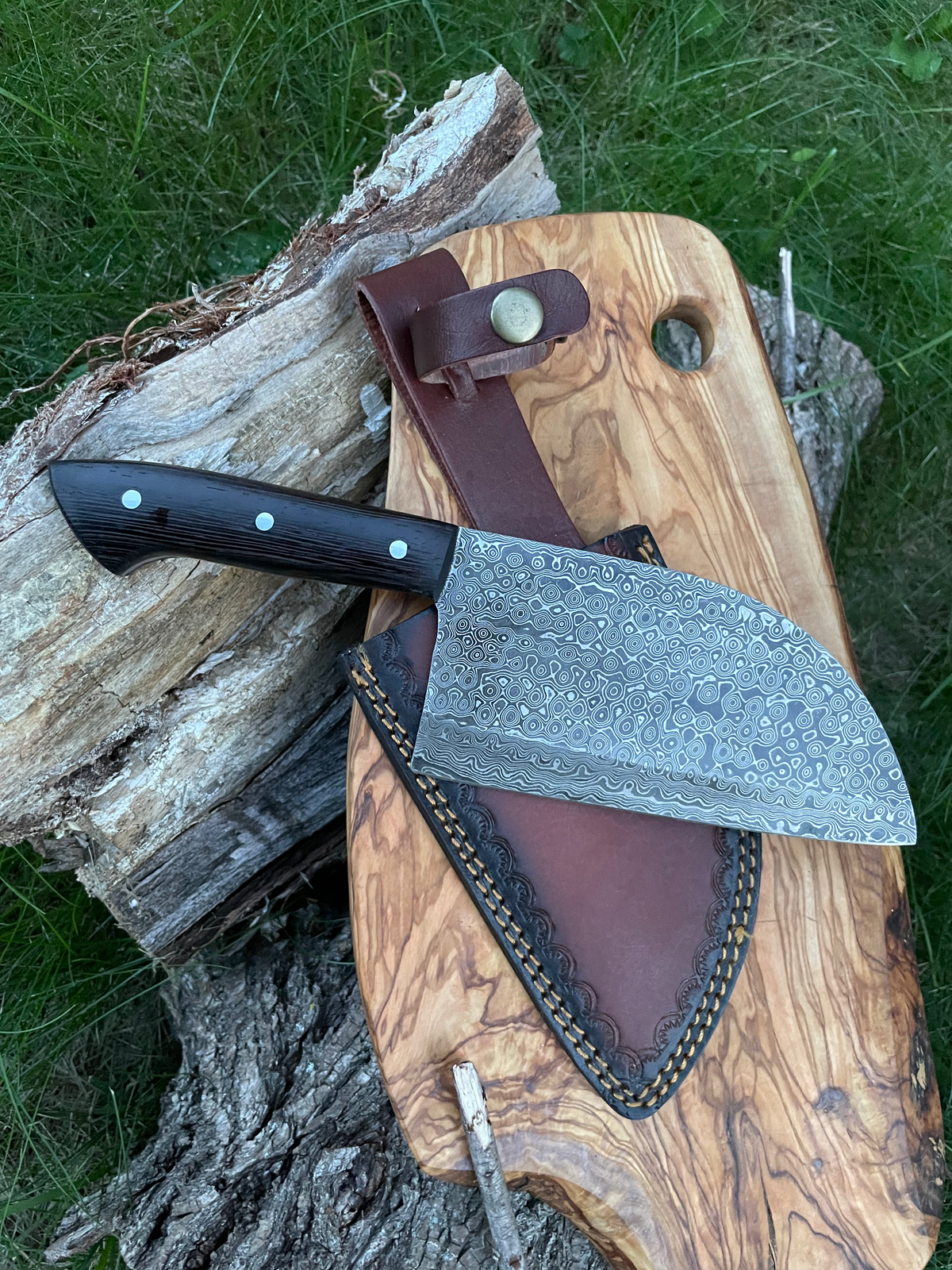 Damascus steel Sheeptoe Cleaver TK-011 with patterned blade, black riveted handle, leather sheath on Tampa Home & Garden Store