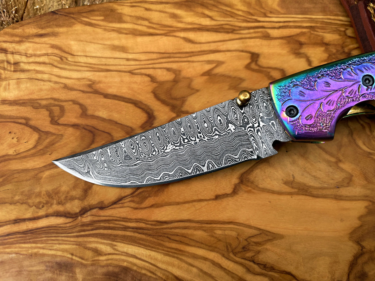 Damascus pocket knife with rainbow titanium handle and engraved floral bolster Titan TF-015 on Tampa Home & Garden Store