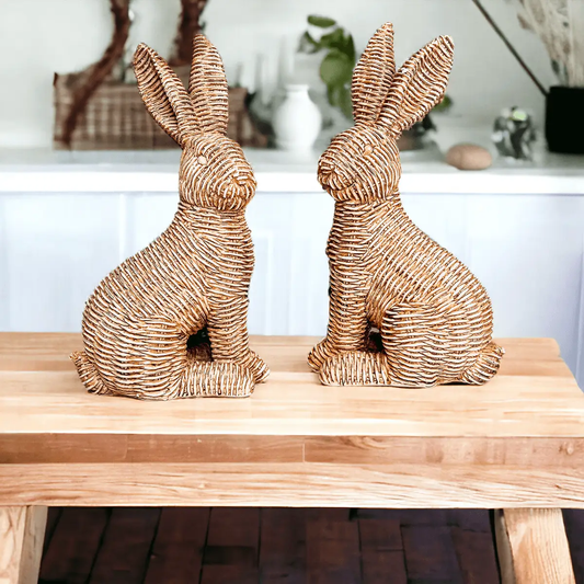 Basket Weave Bunny pair in natural wicker, two bunny statues on a wooden table on Tampa Home & Garden Store