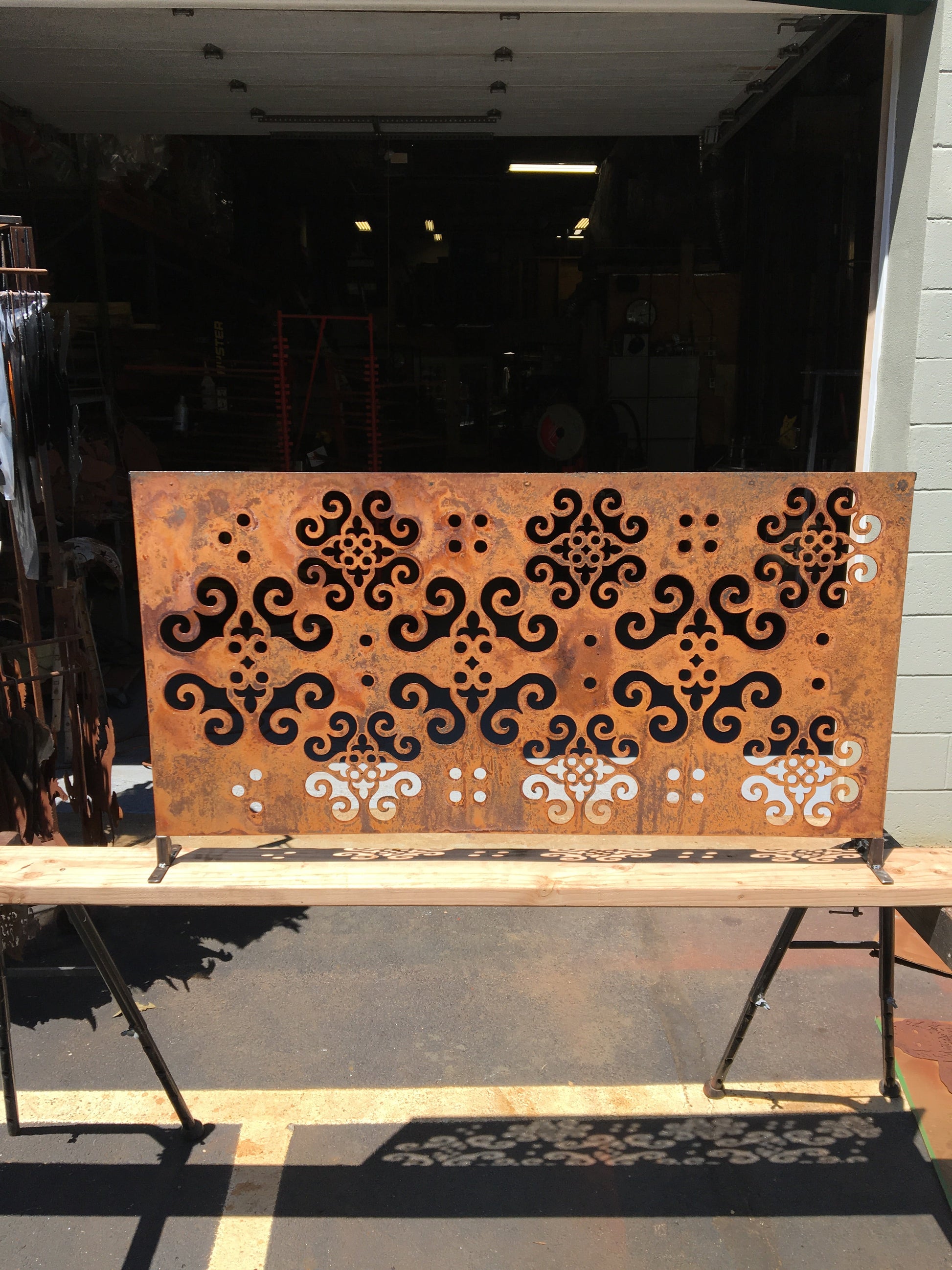 Outdoor privacy panel rusted metal wall sculpture with ornate scrolling cutouts, 46 inches tall on Tampa Home & Garden Store