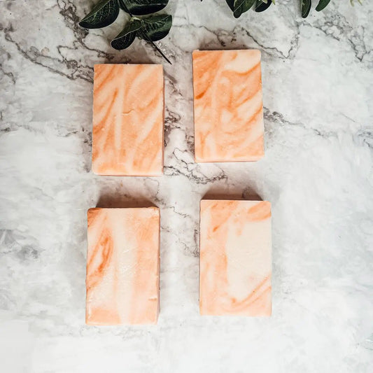 Summertime Citrus soap bars by Gia Roma, four peach-marble blocks on marble surface on Tampa Home & Garden Store