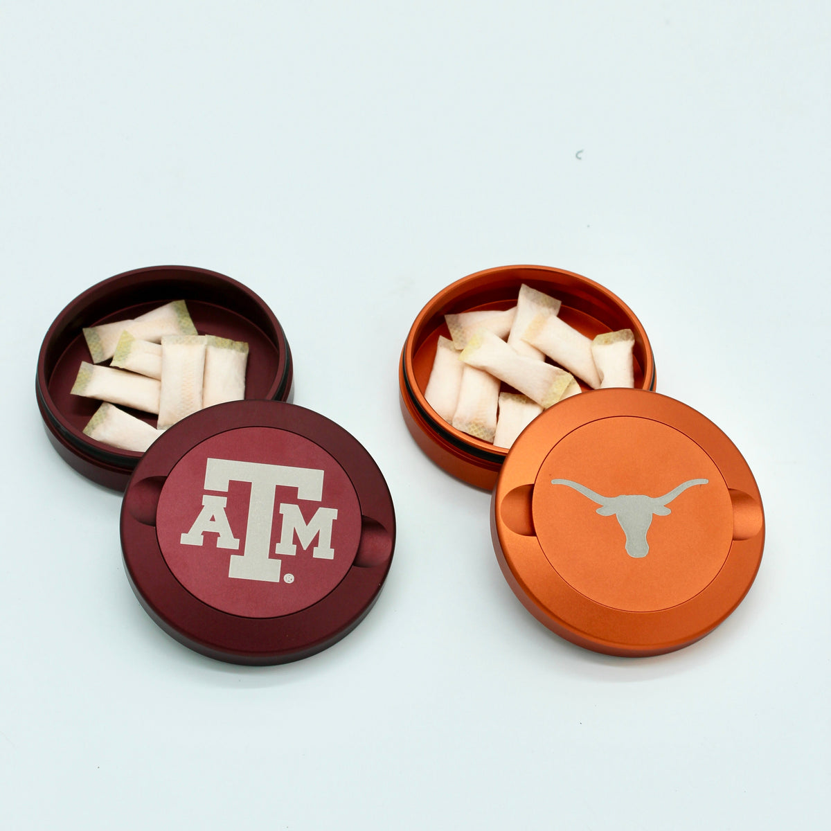 Texas Longhorns metal nicotine pouch cans with longhorn logo and white pouches inside on Tampa Home & Garden Store