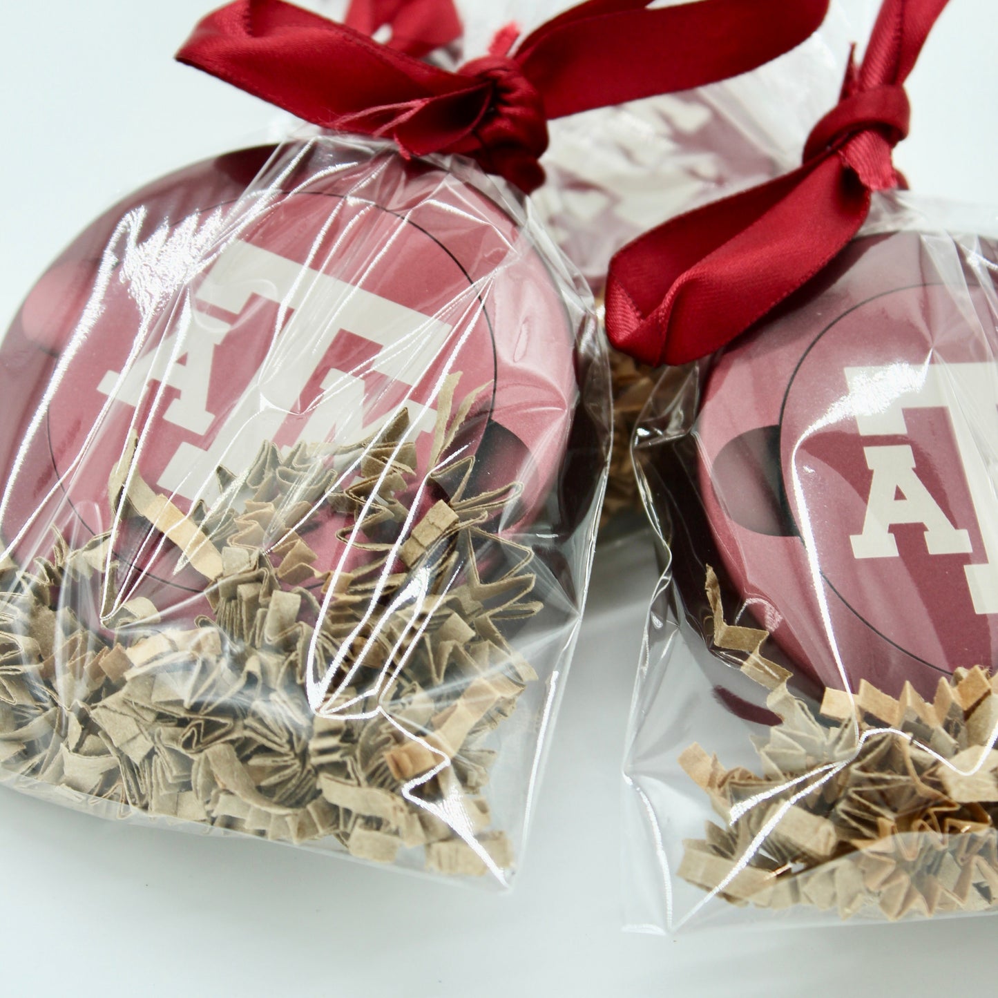 Texas A&M metal nicotine pouch cans in maroon gift packaging with red satin ribbon on Tampa Home & Garden Store