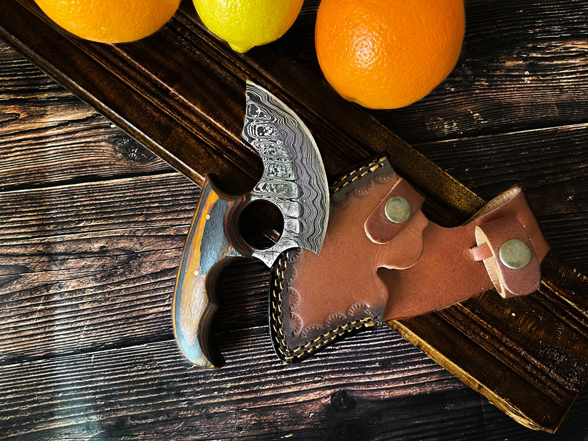 Titan Custom Alaskan Ulu style Damascus knife with patterned blade, wood handle, leather sheath on Tampa Home & Garden Store