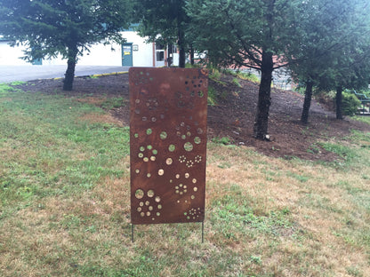 Metal privacy screen by Rustica Ornamentals, rusted perforated steel panel with circular cutouts on Tampa Home & Garden Store
