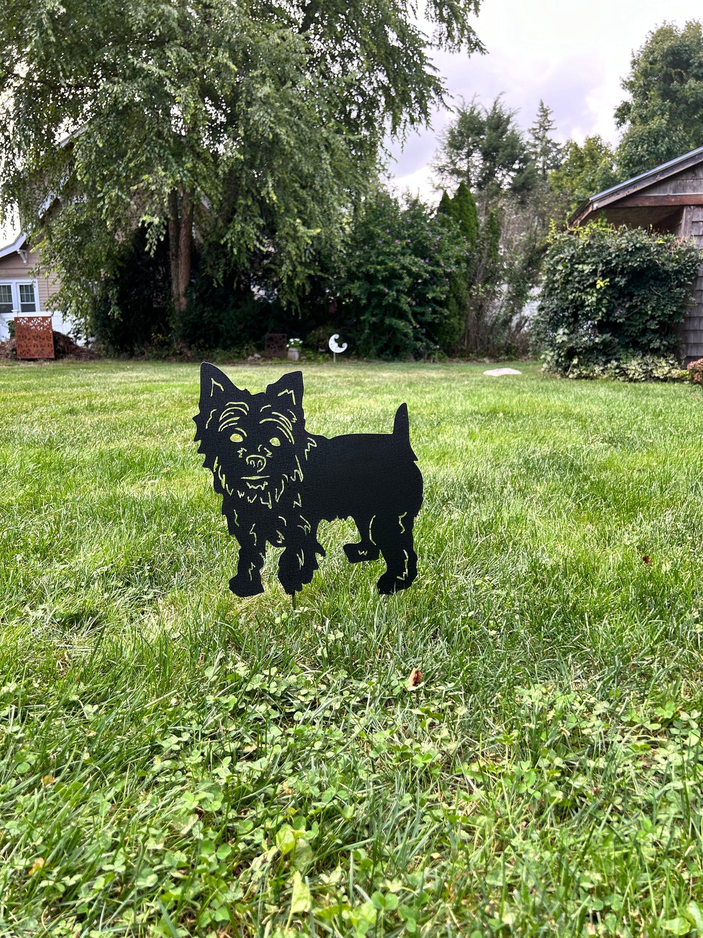 Yorkie dog statue metal garden silhouette in black in a grassy yard on Tampa Home & Garden Store