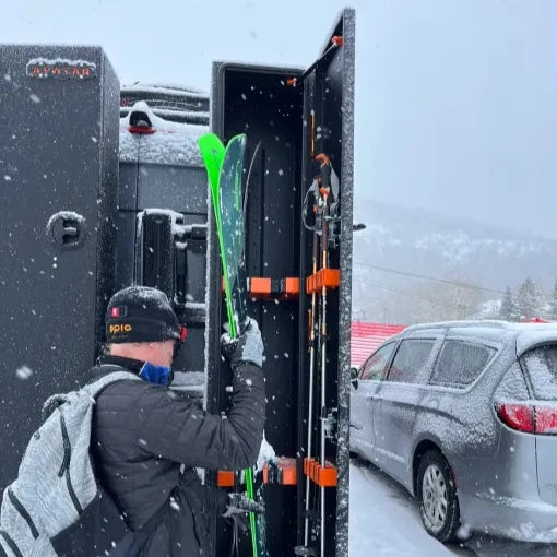 Avatar offroad Ski 4 Storage Box on trailer with neon green skis and orange latches in snow on Tampa Home & Garden Store