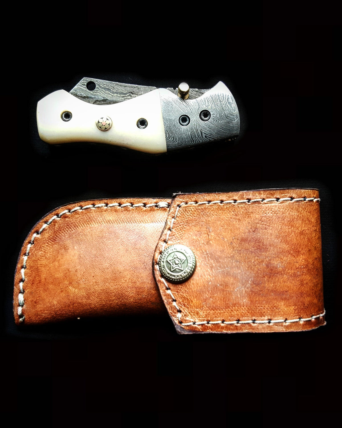 TF-007 folding knife by Titan International K with damascus blade and cream handle beside sheath on Tampa Home & Garden Store
