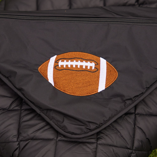 Football patch on black quilted puffer blanket with zipper on Tampa Home & Garden Store