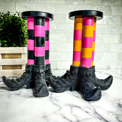 Wicked Witch Candle Holders Gia Roma pair with pink/black and orange/pink striped legs and boots on Tampa Home & Garden Store
