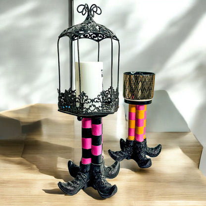 Wicked Witch Candle Holder by Gia Roma; 2 black lanterns on pink and orange striped legs on Tampa Home & Garden Store