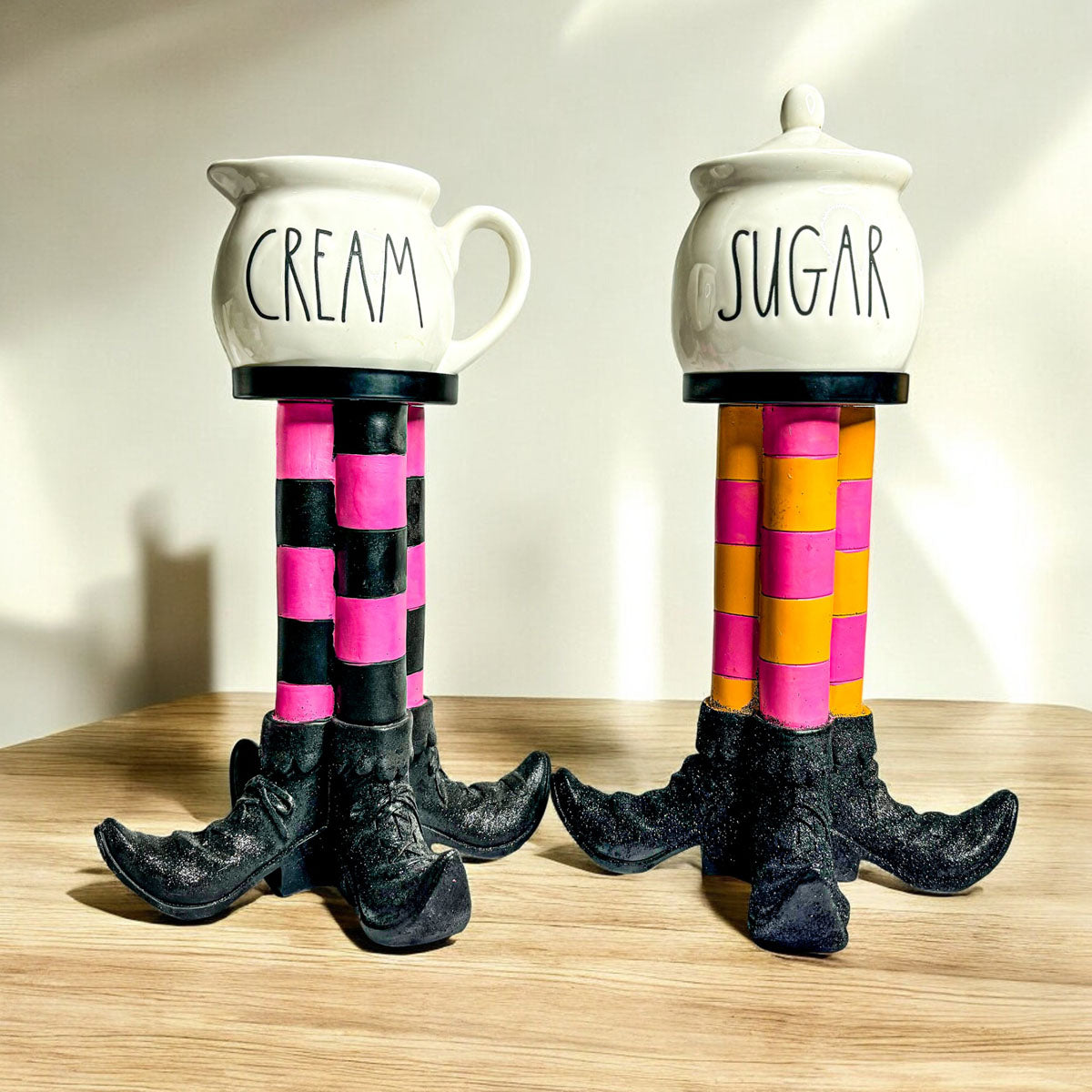 Wicked Witch Candle Holder pair with striped legs and cream and sugar pots by Gia Roma on Tampa Home & Garden Store