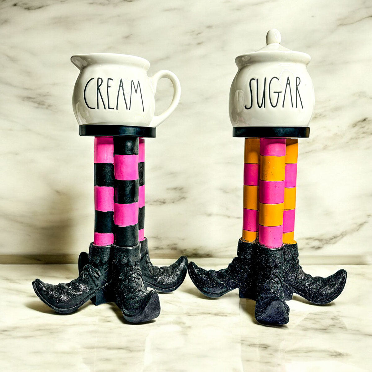Wicked Witch Candle Holder pair with striped legs and cream and sugar jars on Tampa Home & Garden Store