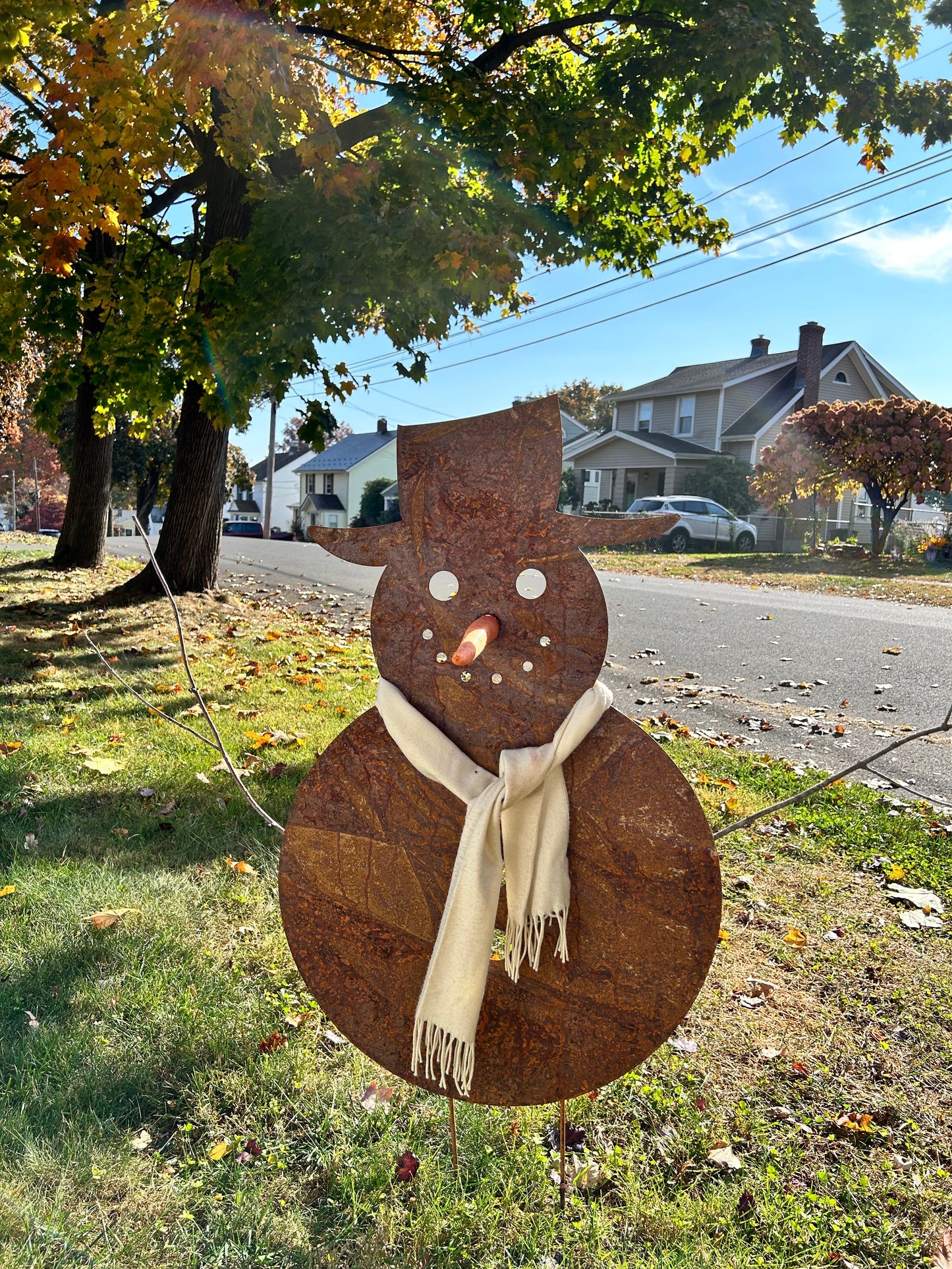 Large rusted metal snowman sculpture with beige scarf, Christmas decor by Rustica Ornamentals on Tampa Home & Garden Store