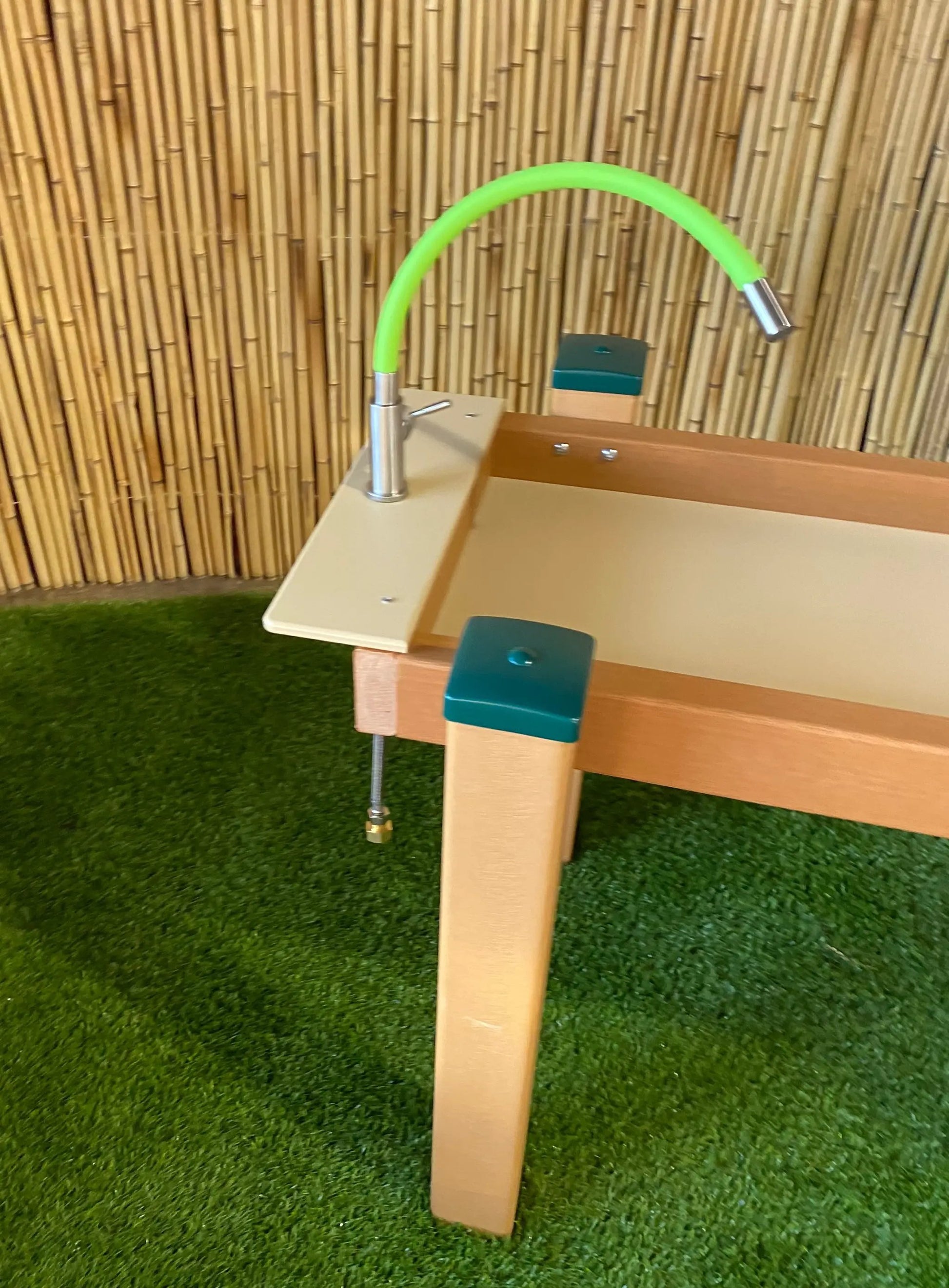 Kids' Station Outdoor Water Works sand/water triple trough with green flexible rubber faucet on wood table on Tampa Home & Garden Store