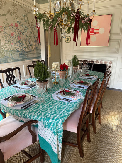 Bluebell Emerald Tablecloth emerald green botanical linen on a dining table with glassware on Tampa Home & Garden Store