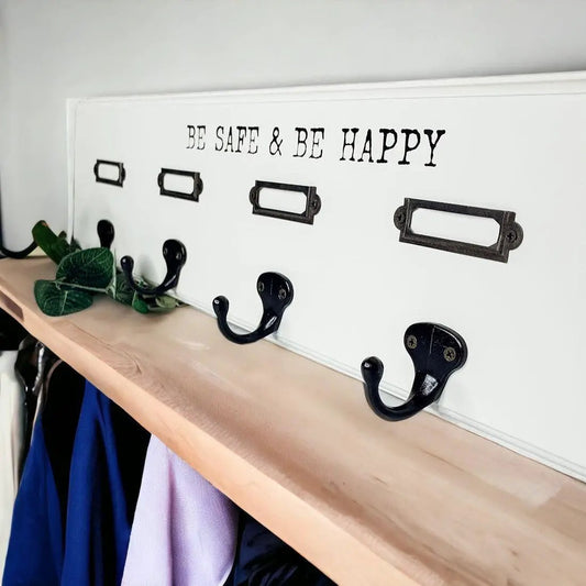 Wooden Hang This Way wall hook rack with five black metal hooks on a white panel on Tampa Home & Garden Store
