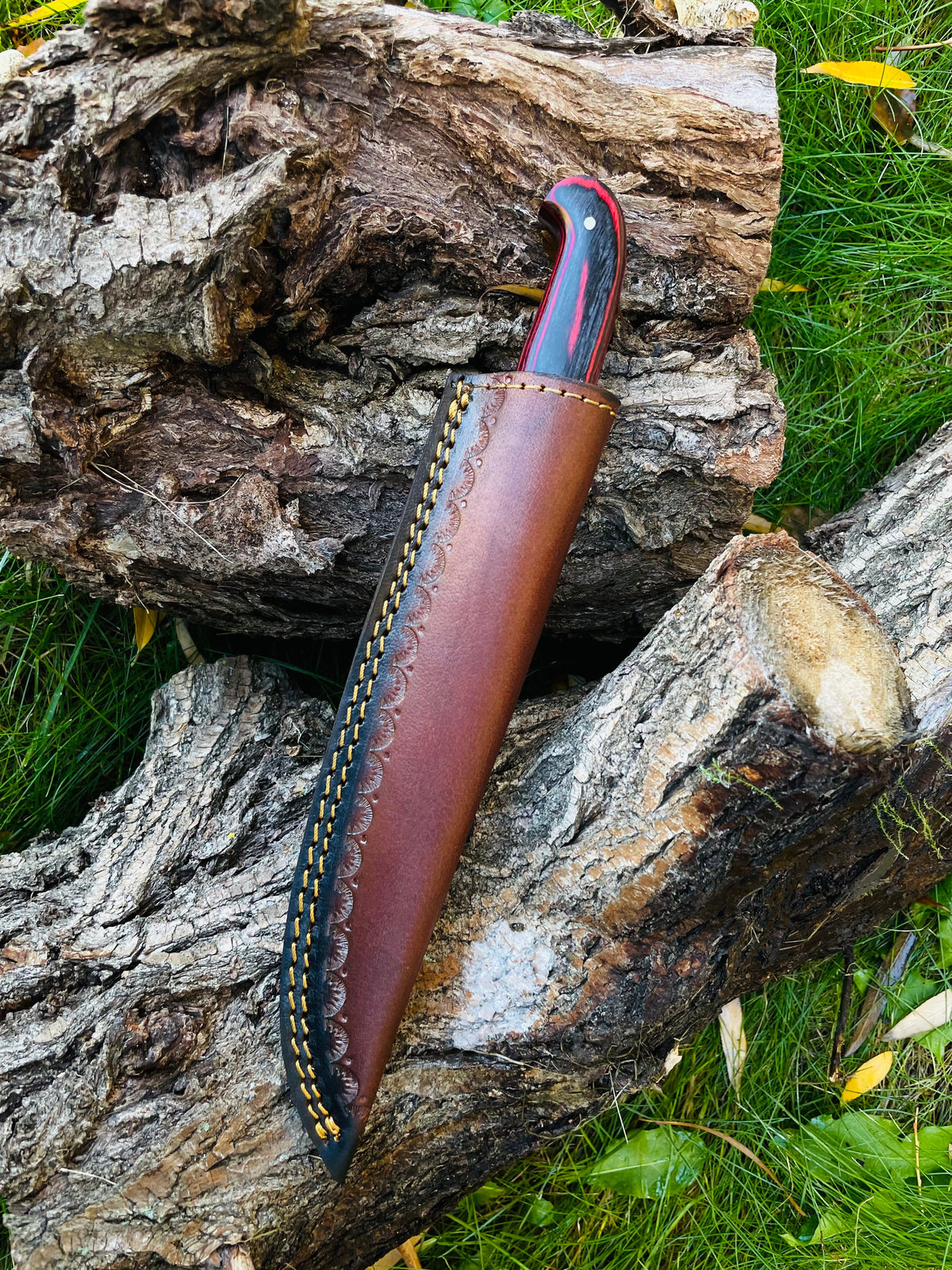 Damascus steel custom flay knife TK-050 with red/black/blue handle in brown leather sheath on Tampa Home & Garden Store